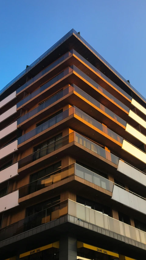 a building with many windows near a street light