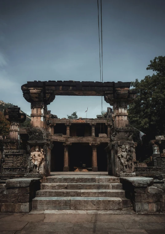 some steps to an ancient building and tree