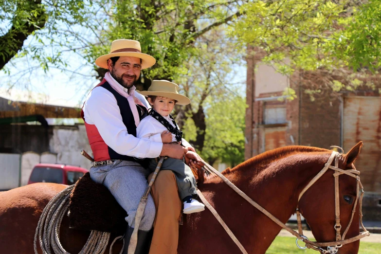 two people that are on some brown horses