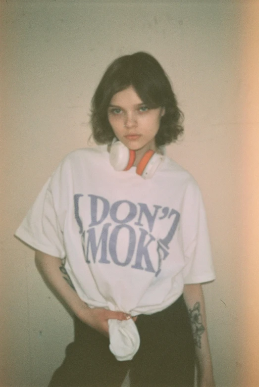 a woman poses while wearing an i don't mok shirt