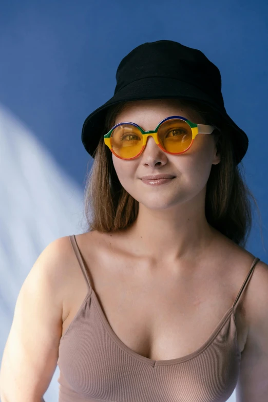 a woman with a hat and sunglasses
