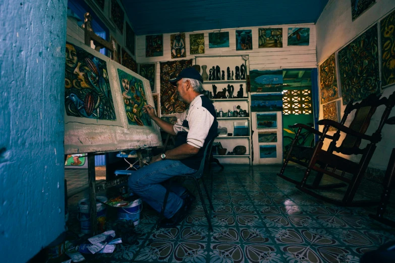 an image of a man working on a piece of artwork