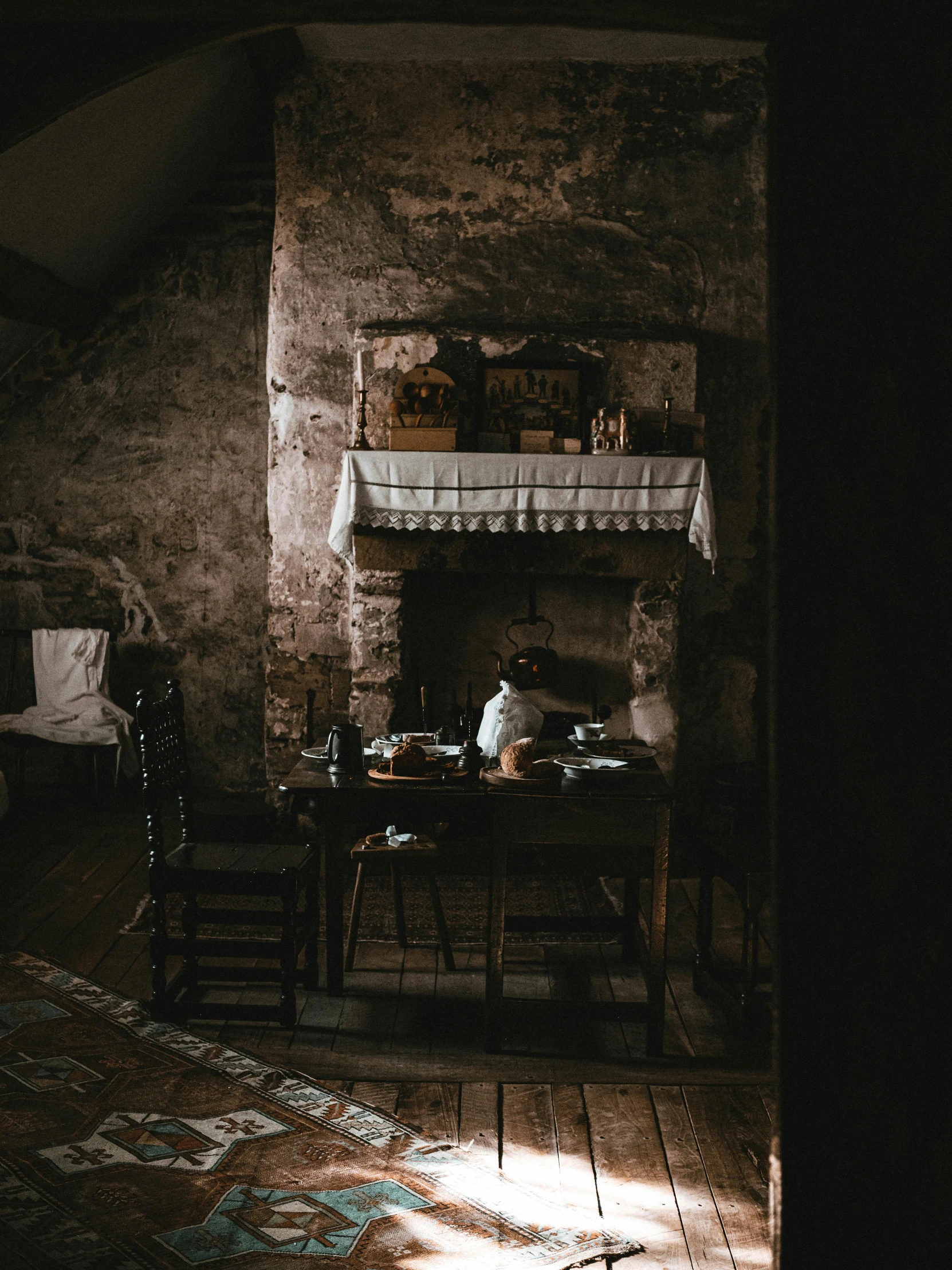 the living room is dark and dirty with someone inside