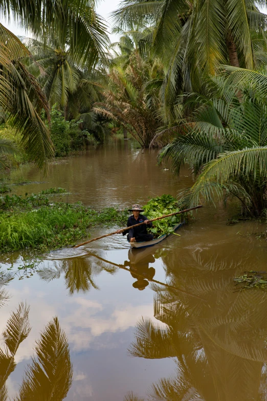 a person on a boat in a river