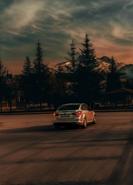 a car is driving in the city street at night