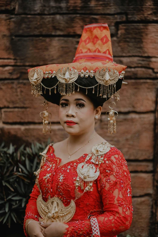 a woman wearing an oriental inspired head piece