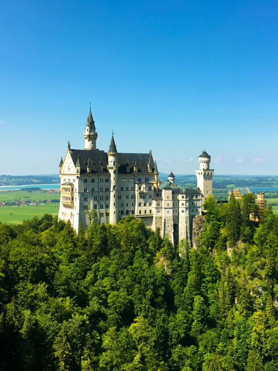 there is an old castle with three towers and trees