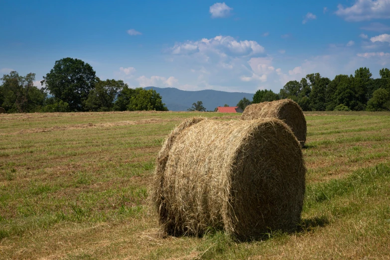 there is a hay bail in the middle of the field