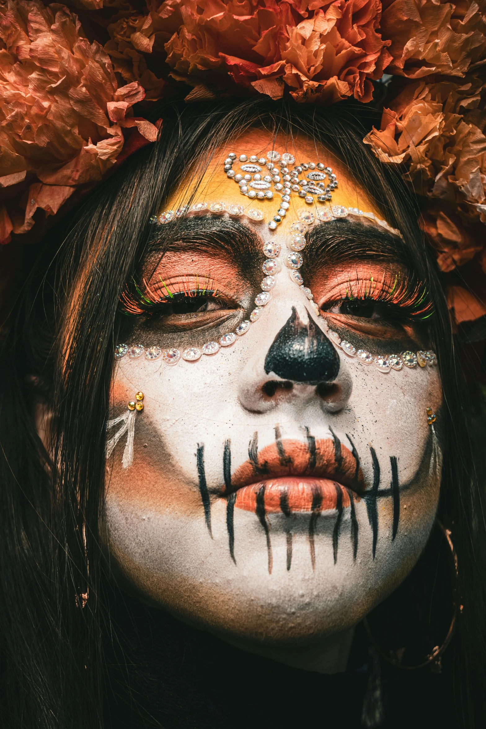 a girl is adorned in makeup with flowers on her head