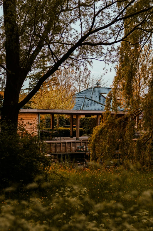 a park setting with a gazebo, benches and trees