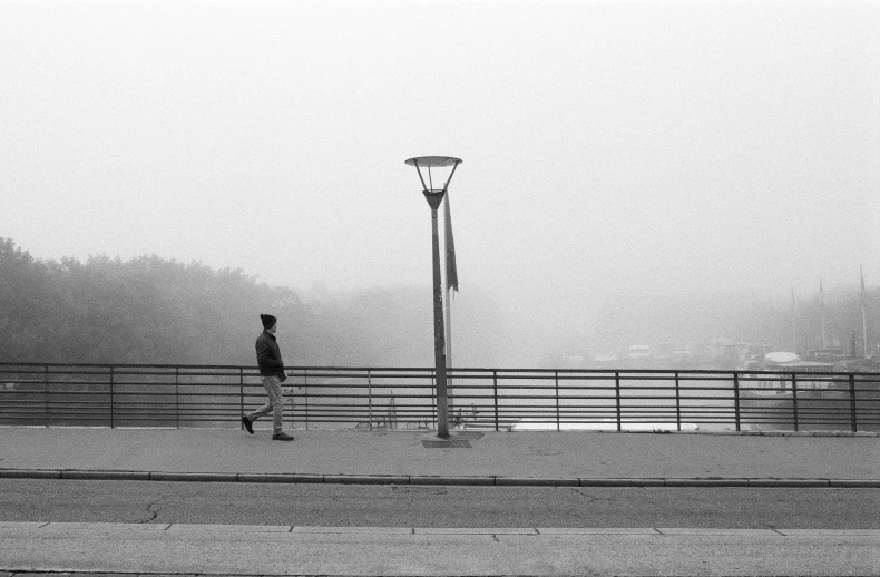 a woman is looking down at the street