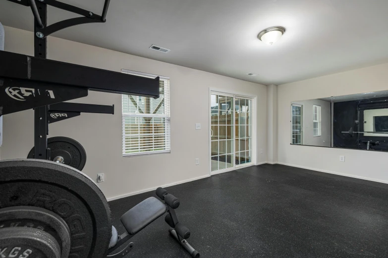 a room that has various weight machines in it