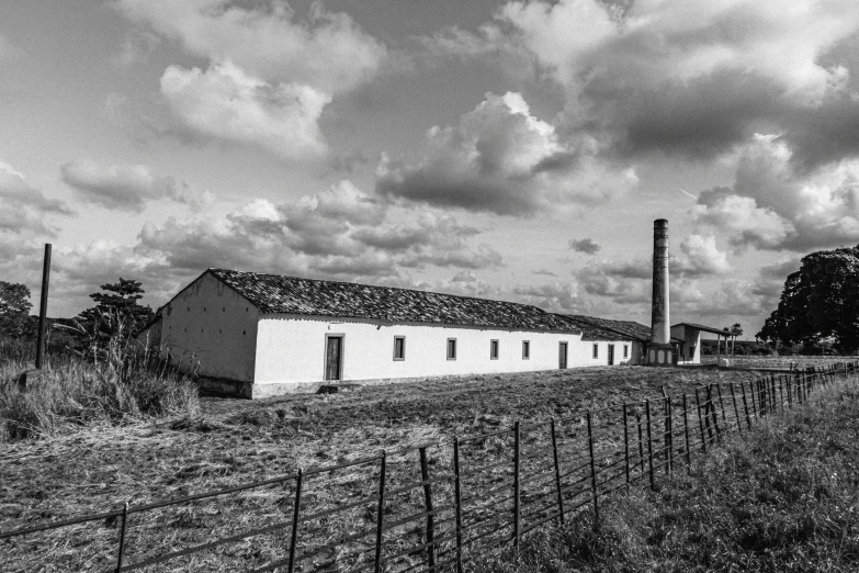 an old farm house near some farm fields