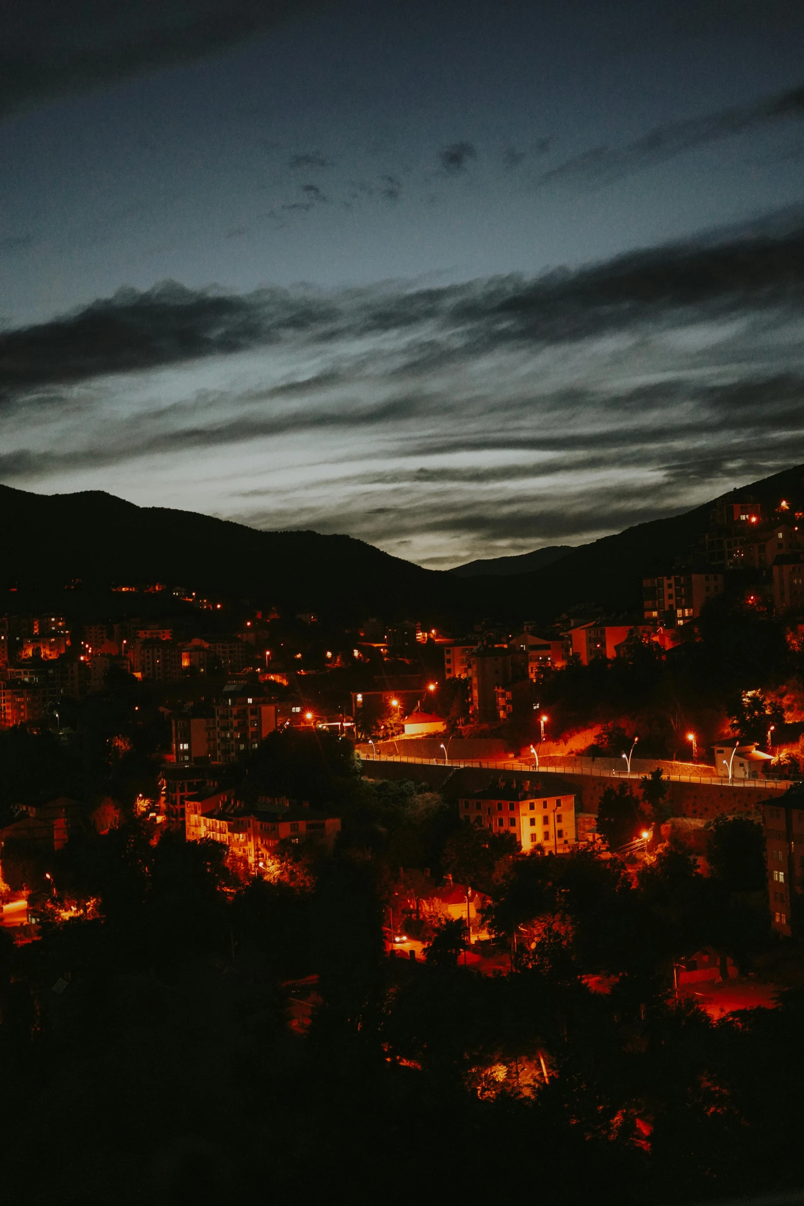 there is an amazing view of a town with some lights on at night