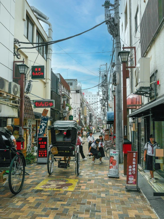 there are many people walking and riding motorcycles down this street