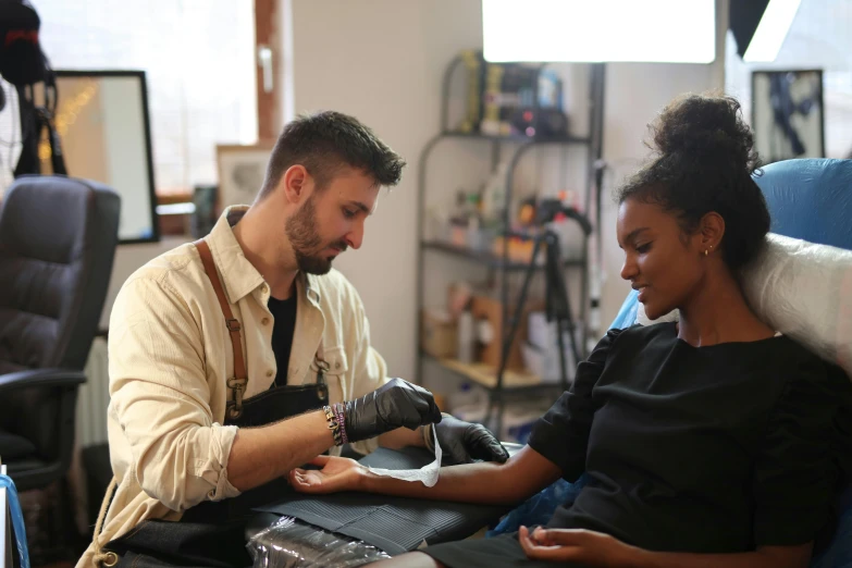 man and woman getting hair cut in a salon