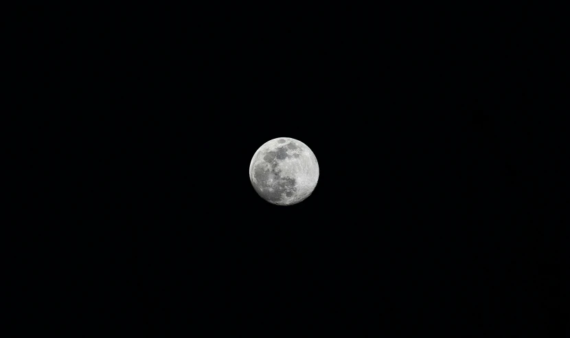 a full moon with no clouds in the sky