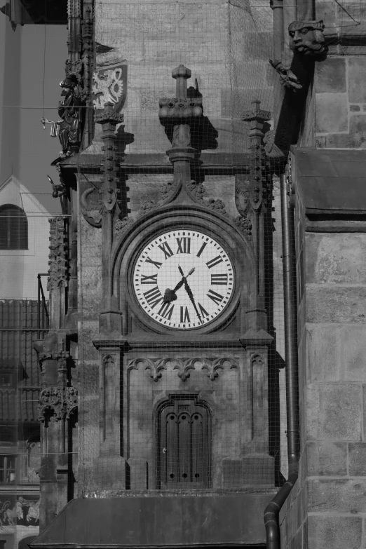 a large clock on the side of a stone building