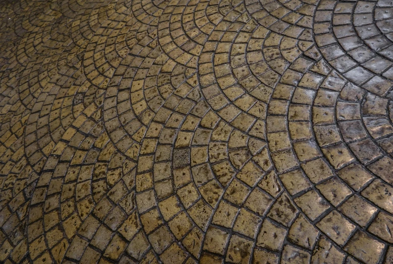 closeup of a circular tiled concrete with dirt