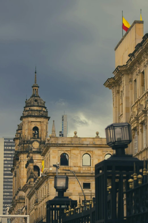 the view from an empty street of old buildings