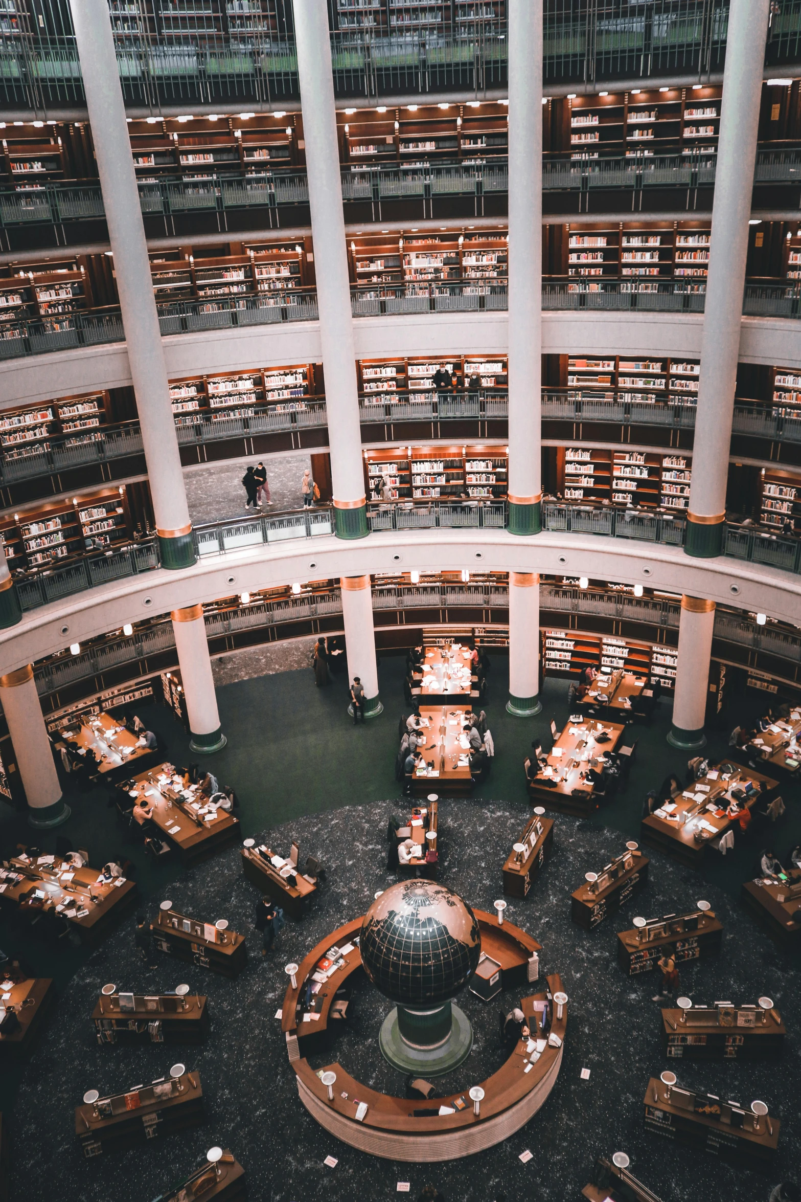 a liry filled with lots of books in a large room