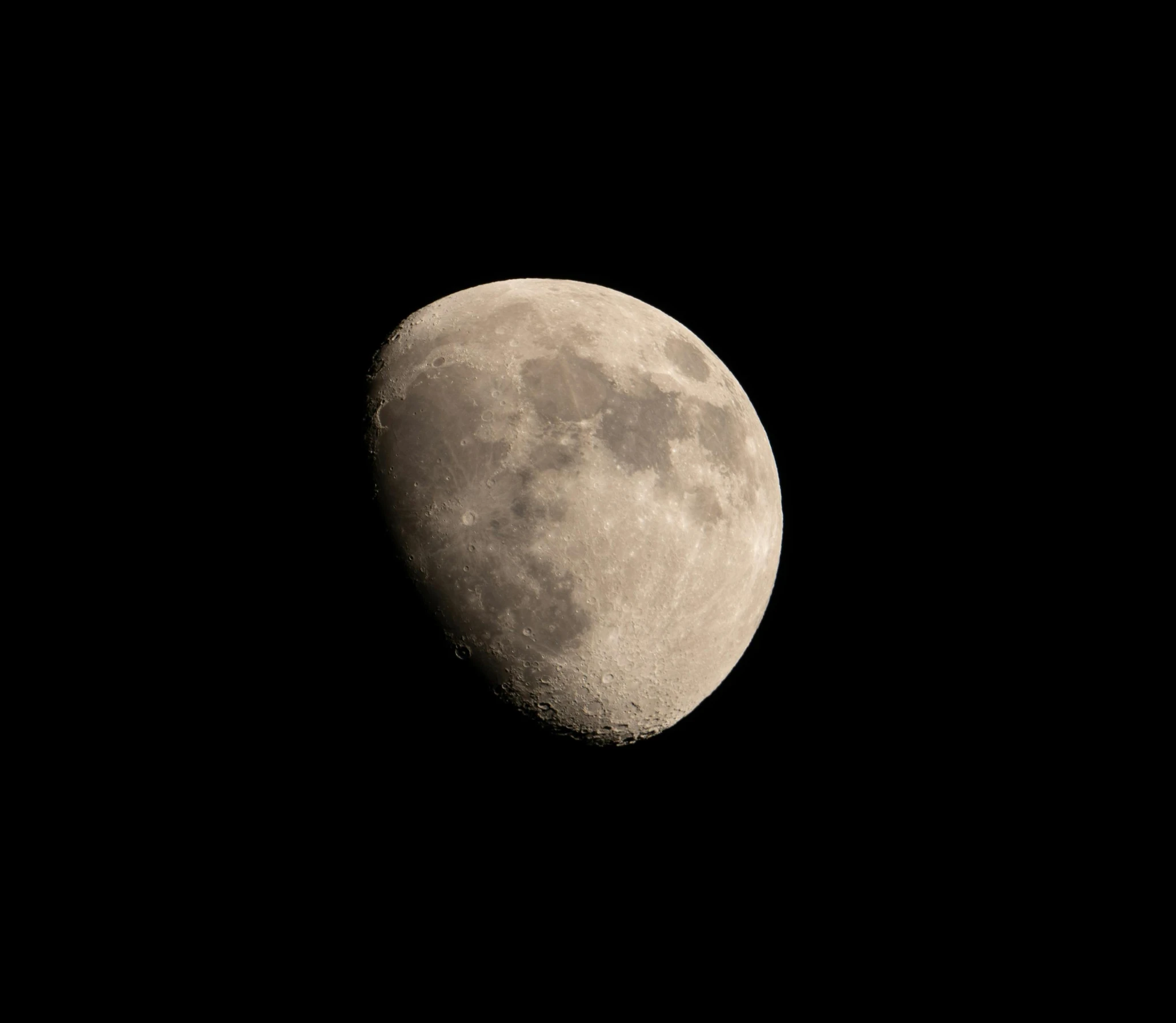 the moon is shown in the dark sky