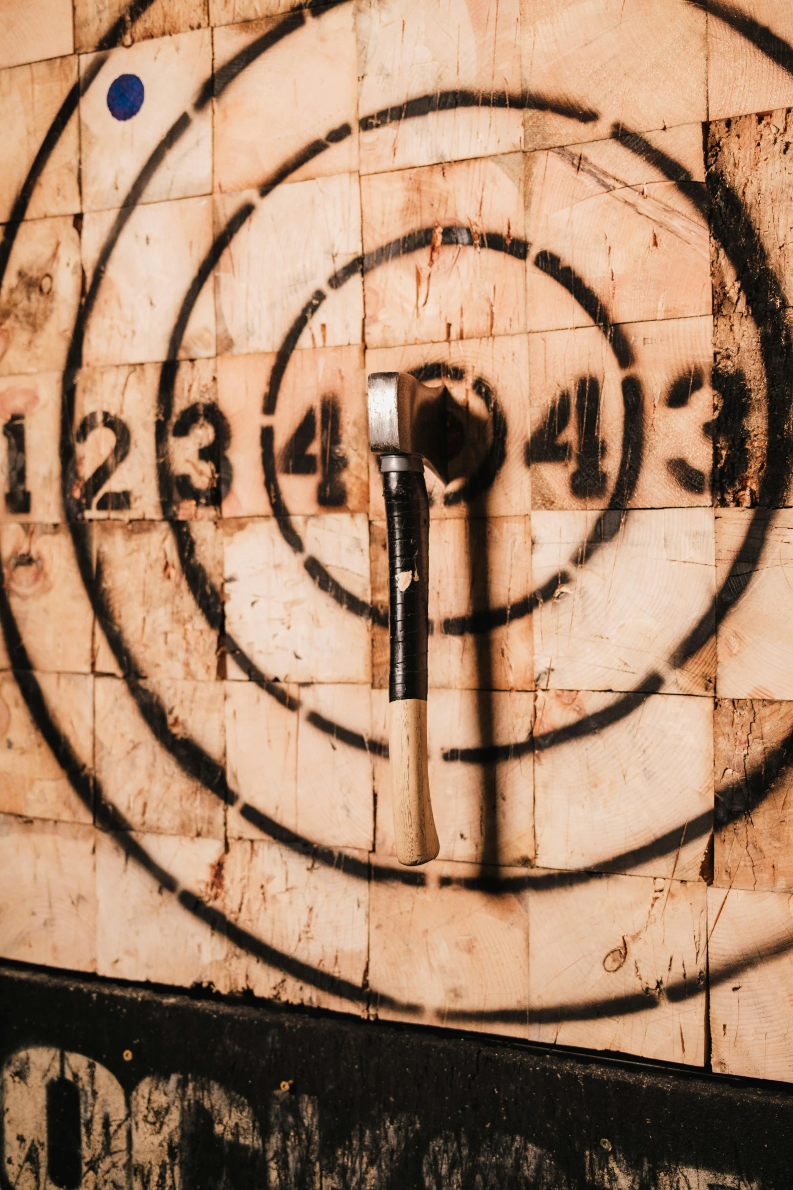 a metal tool sitting on a tile wall