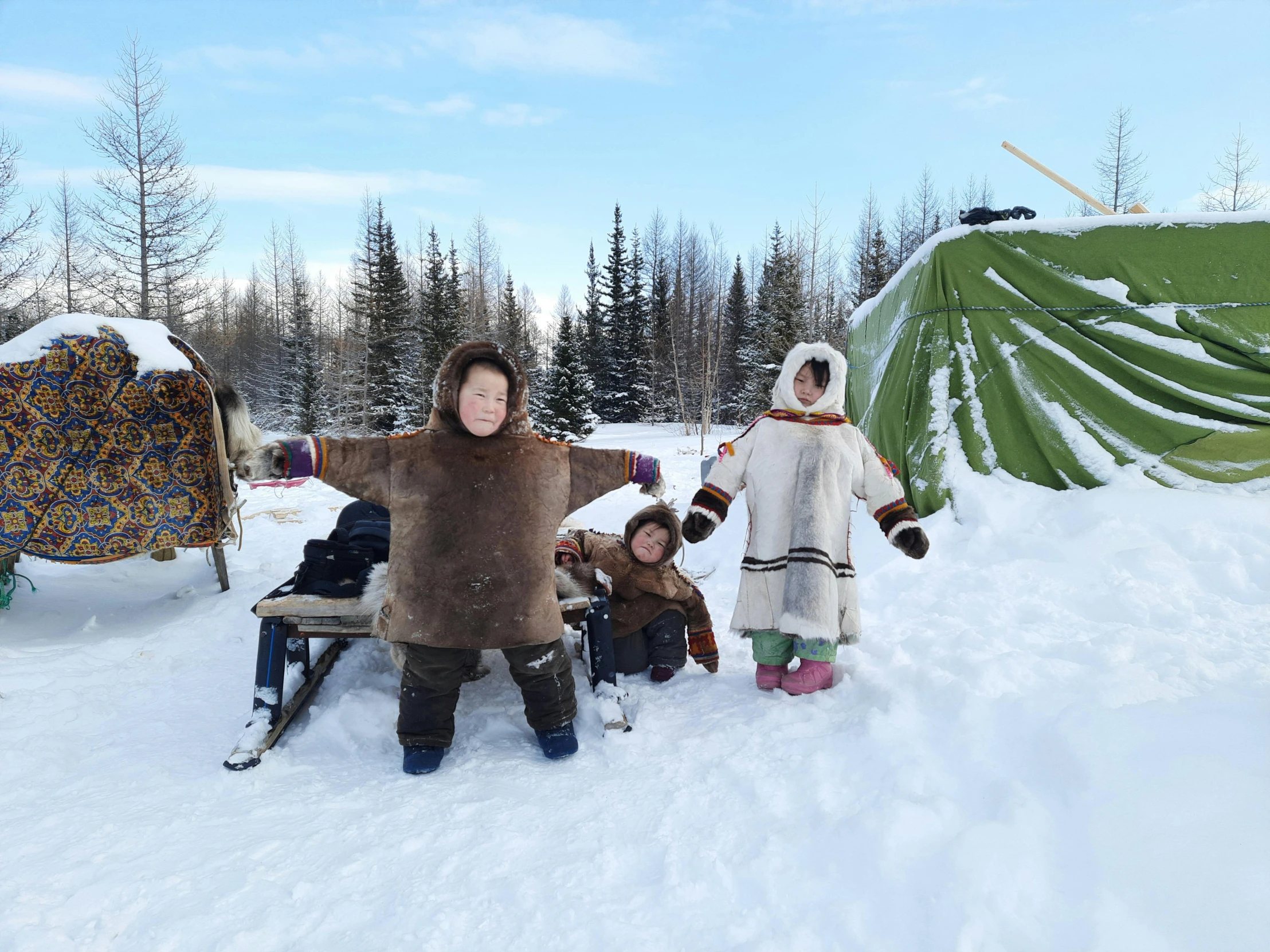 a  and some people that are standing in the snow