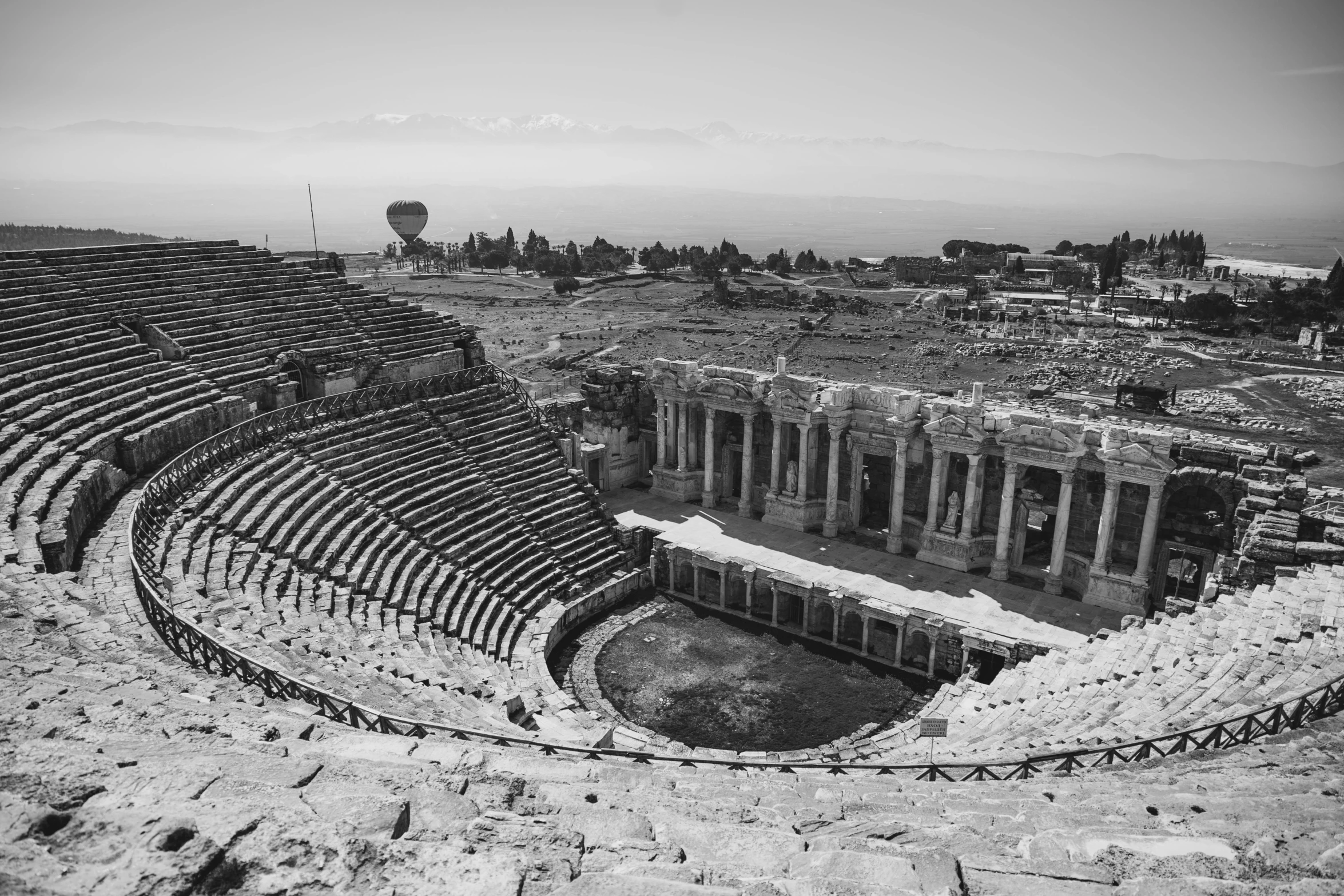 an old ampeteral theater with ruins in the background