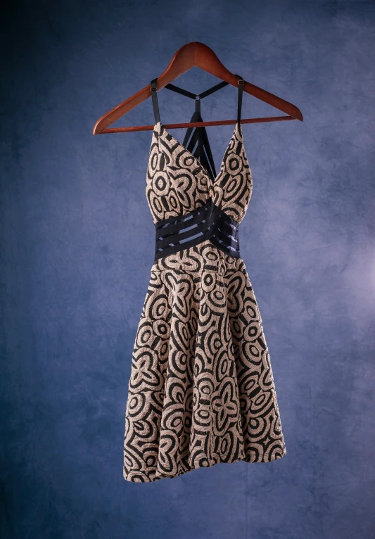 dress on a hanger on a blue background