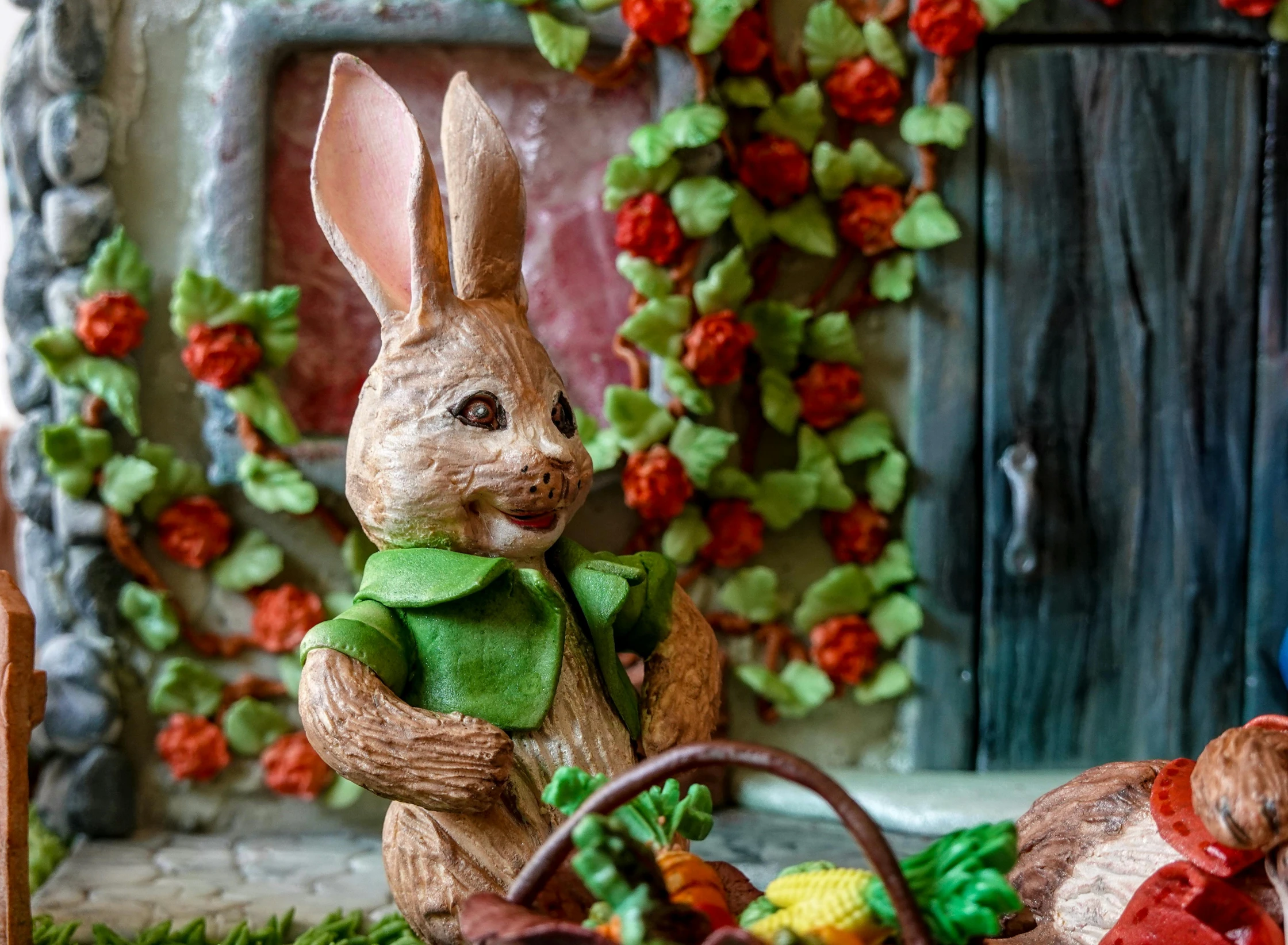 a toy rabbit and a basket of eggs on a table