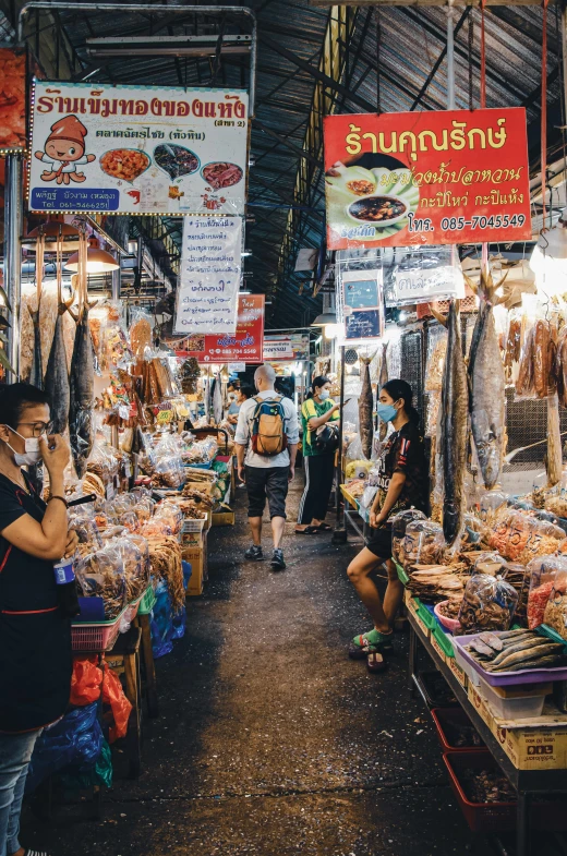 people shopping in the open air market