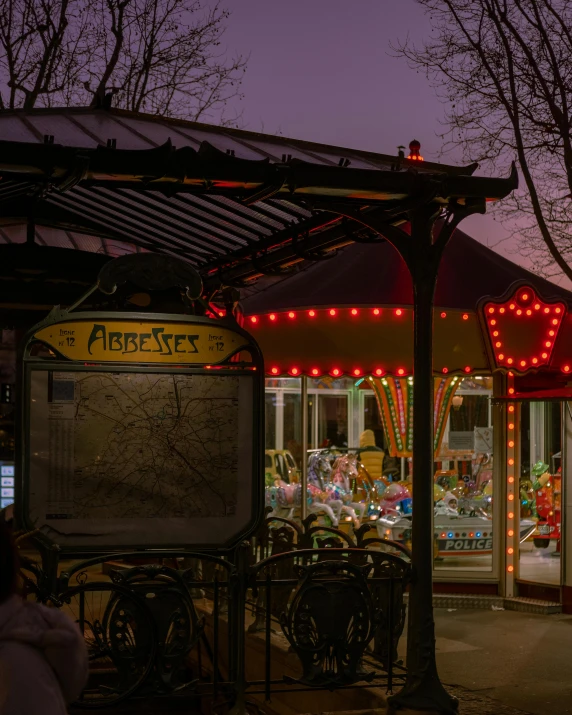 several bicycles are parked outside a store at night