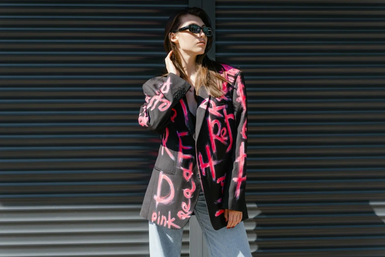 a woman with dark sunglasses posing for the camera