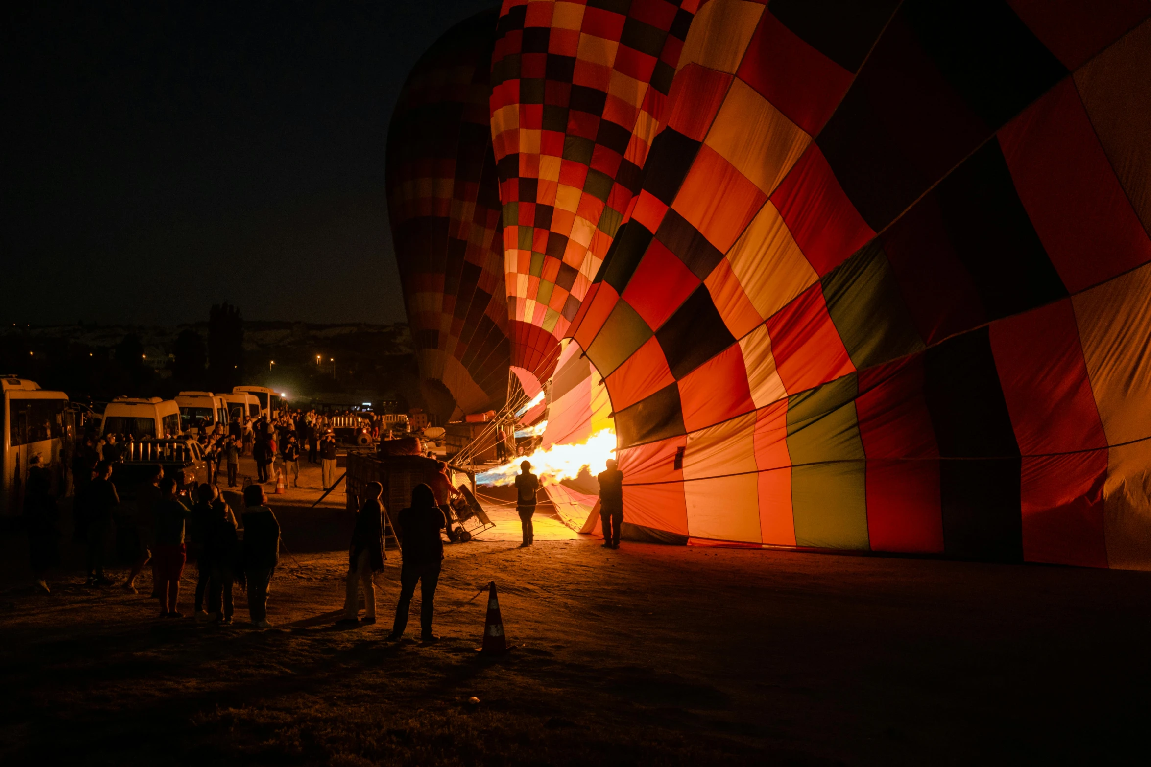 a group of people standing around a big balloon