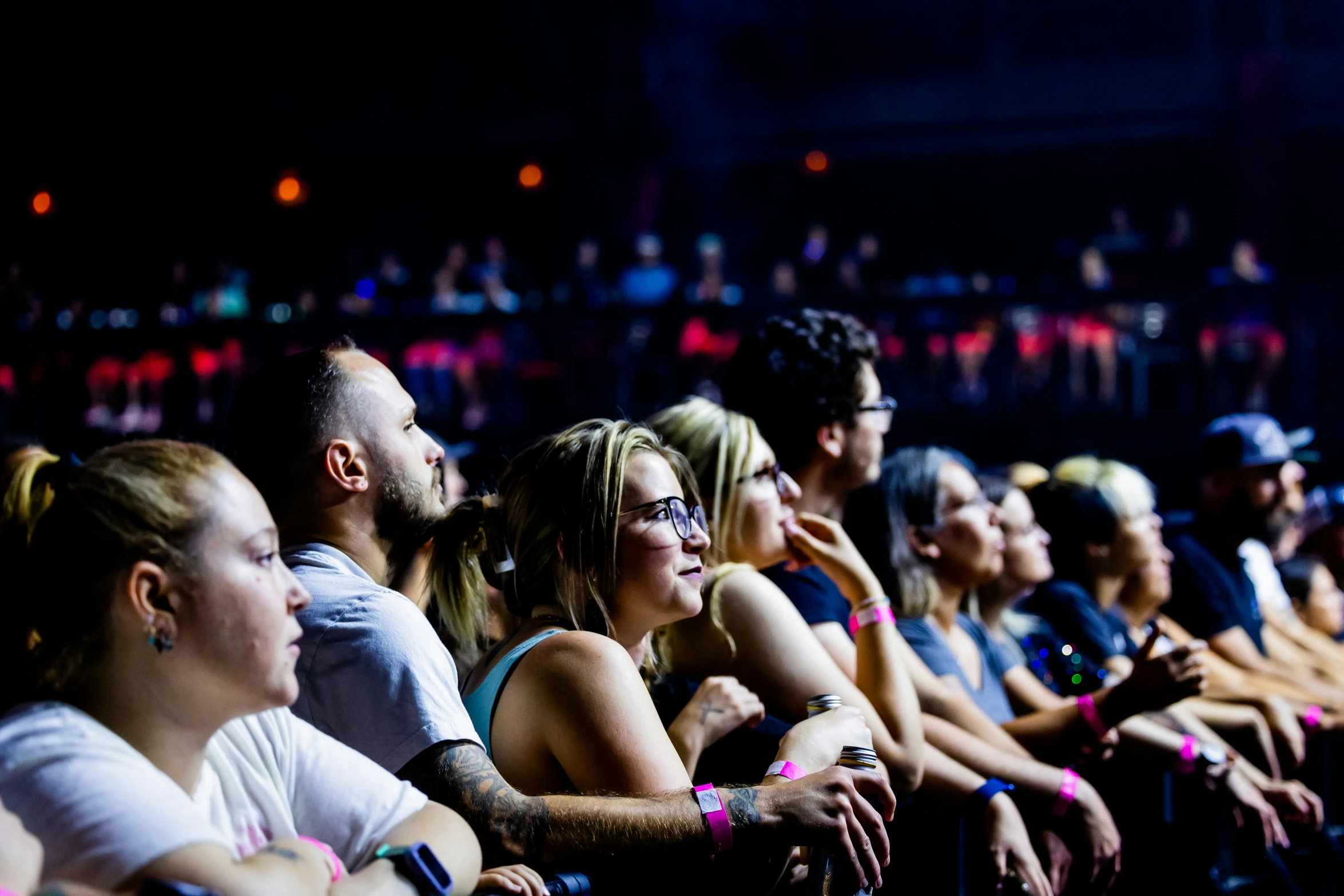 a crowd of people sitting next to each other