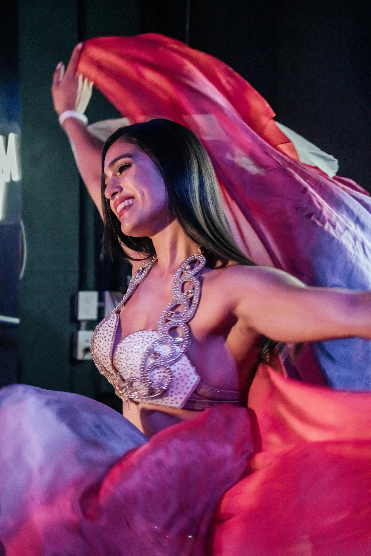 a female in a bikini standing next to a stage