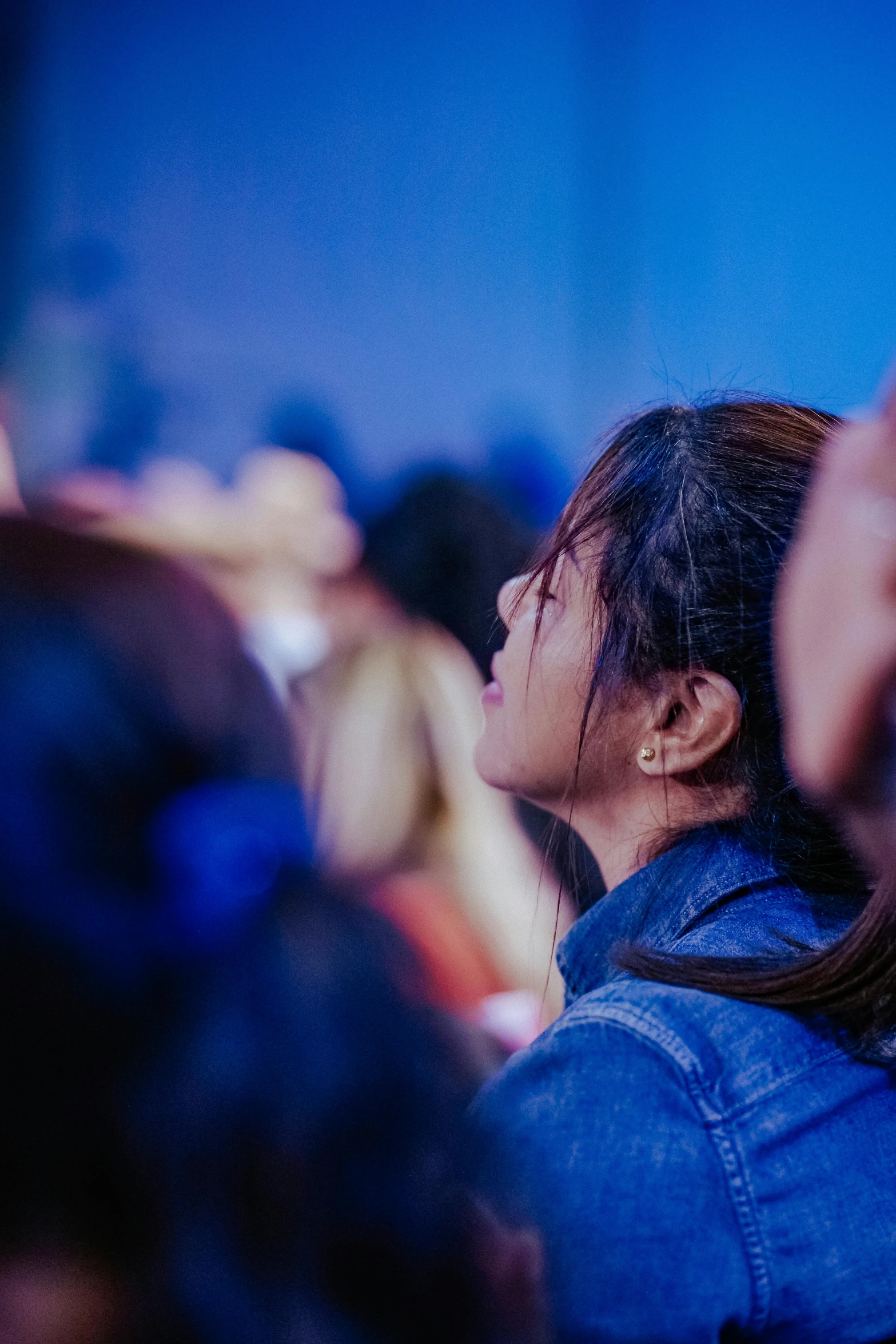 a woman holding her phone up to her head