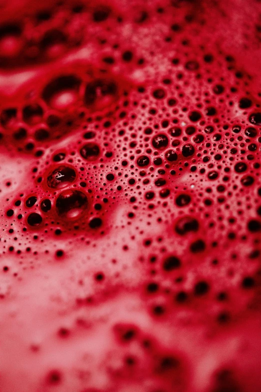 some water bubbles with red colors and very blurry