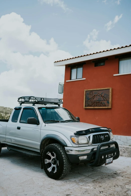 a truck parked outside the side of a building