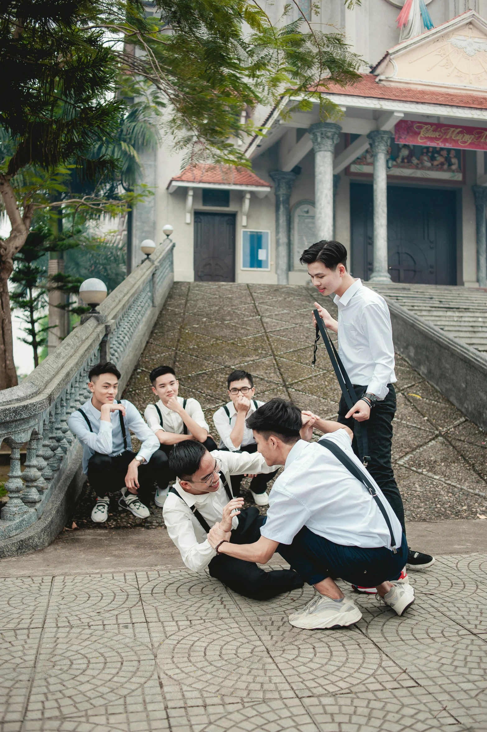 a group of young men are dressed in white shirt and ties