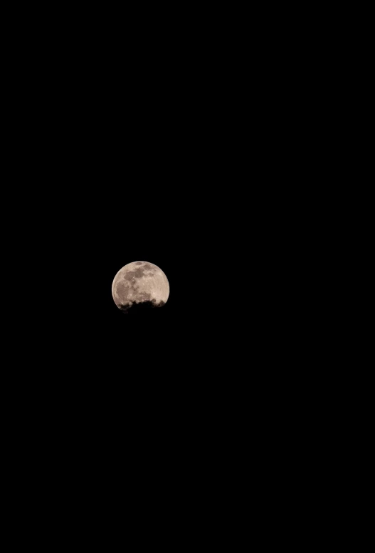 the moon is illuminated by bright lights against a black background