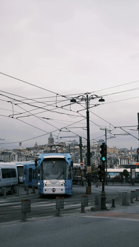 street with cars and busses with traffic lights at roadway