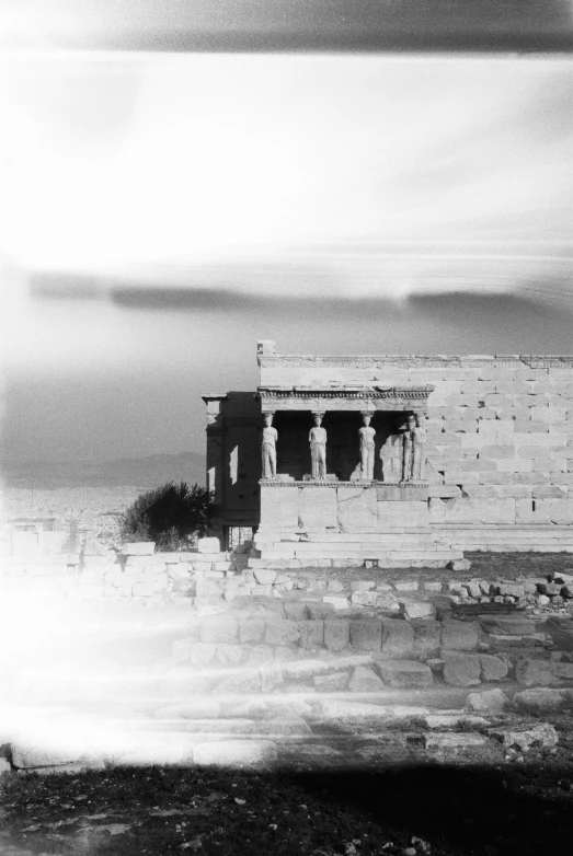 an old black and white image of an ancient temple