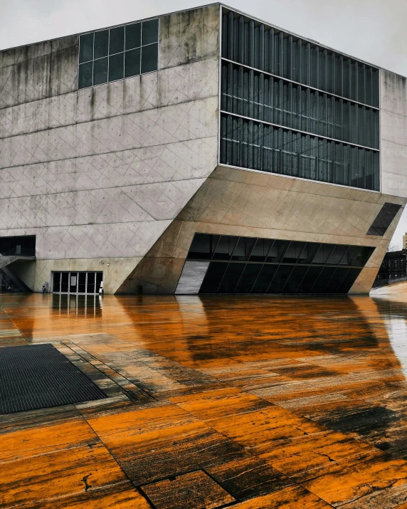 water flowing from a floor outside a large building