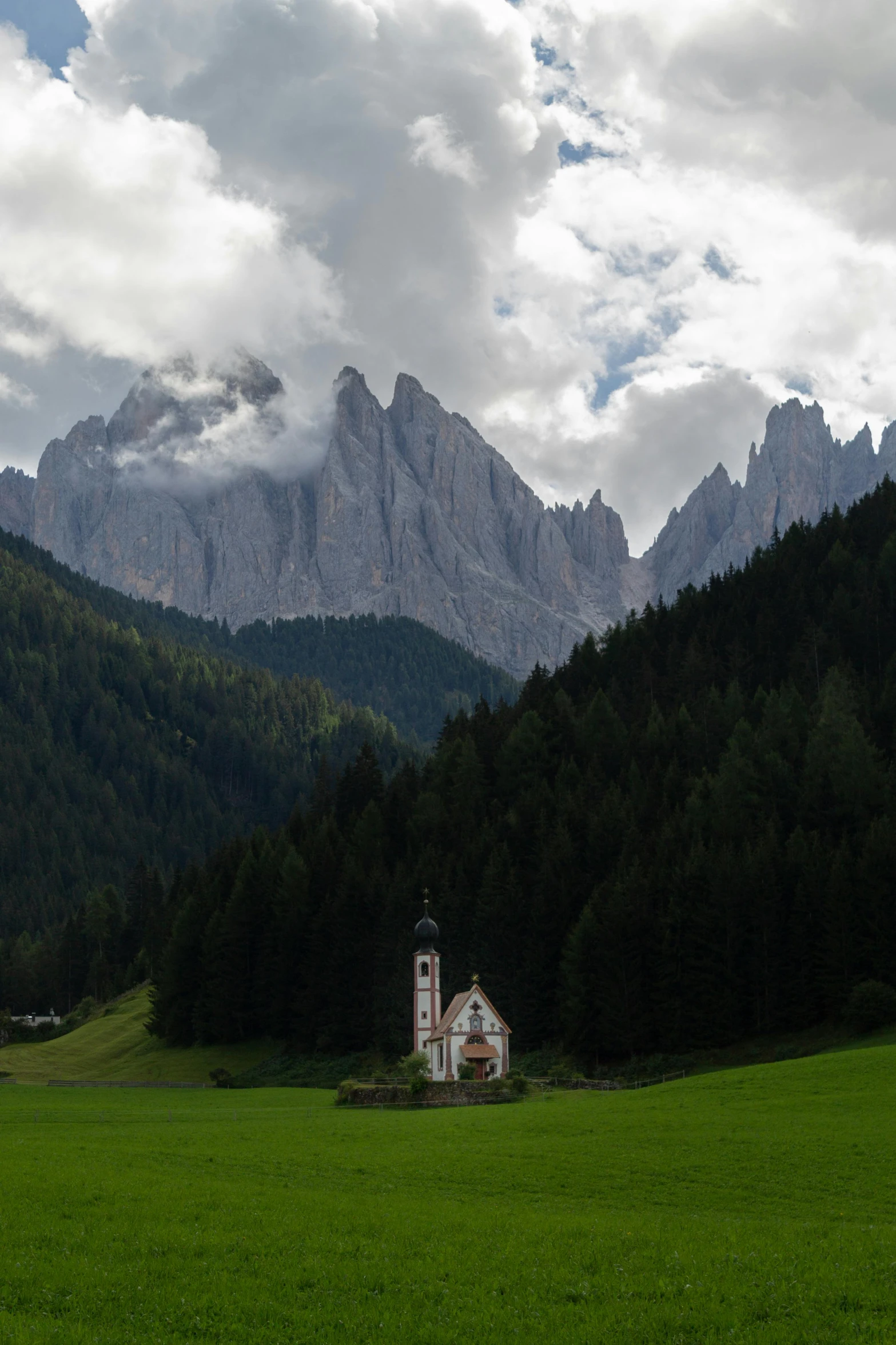 there is a small chapel in the middle of a field