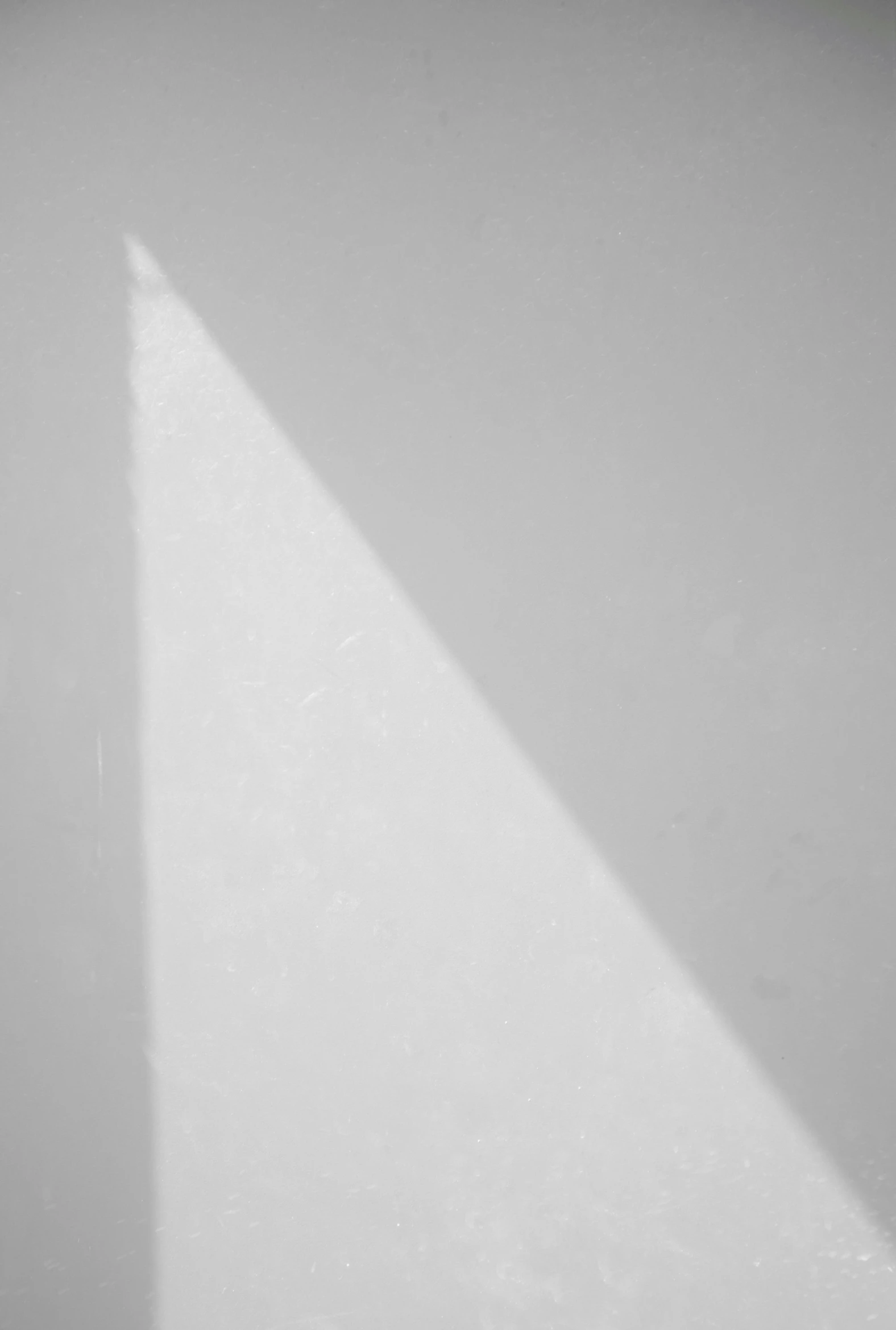 a shadow of a person sitting on the floor