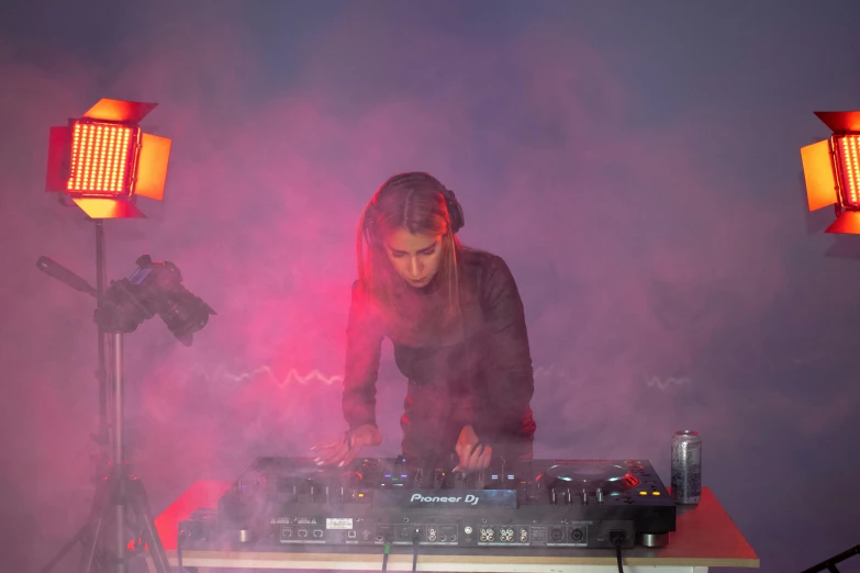 a dj spinning around on his turntable