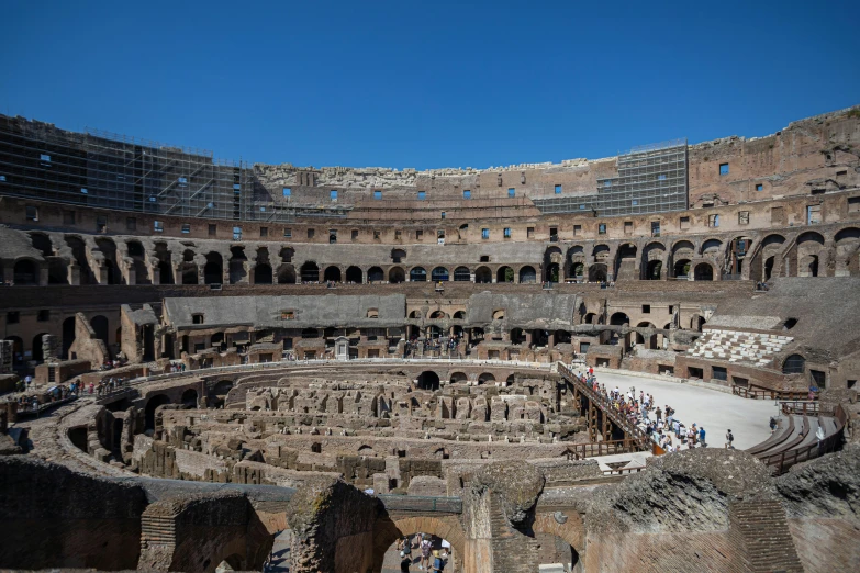 a group of people standing around in a very large structure