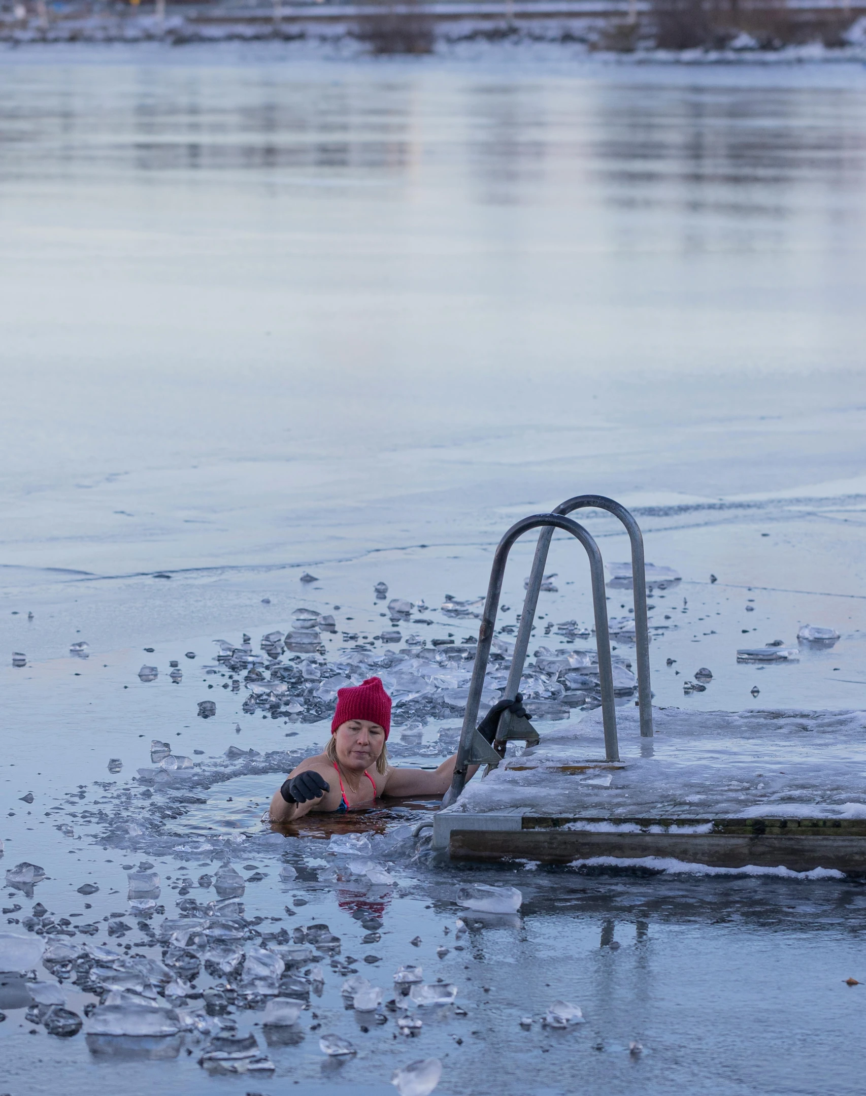 a  laying in the water on an empty pool